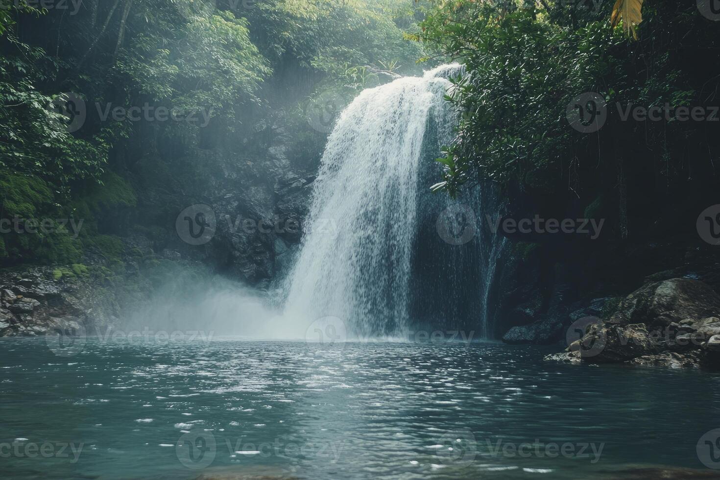 Waterfall Flowing Into a Natural Pool Surrounded by Lush Greenery photo