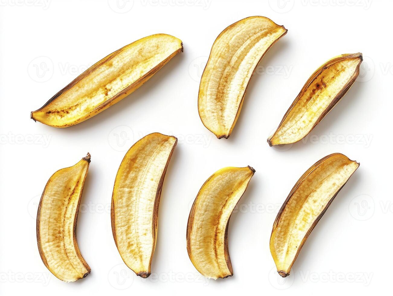 Arrangement of Banana Peels on White Background Creates Minimalist Food Pattern photo