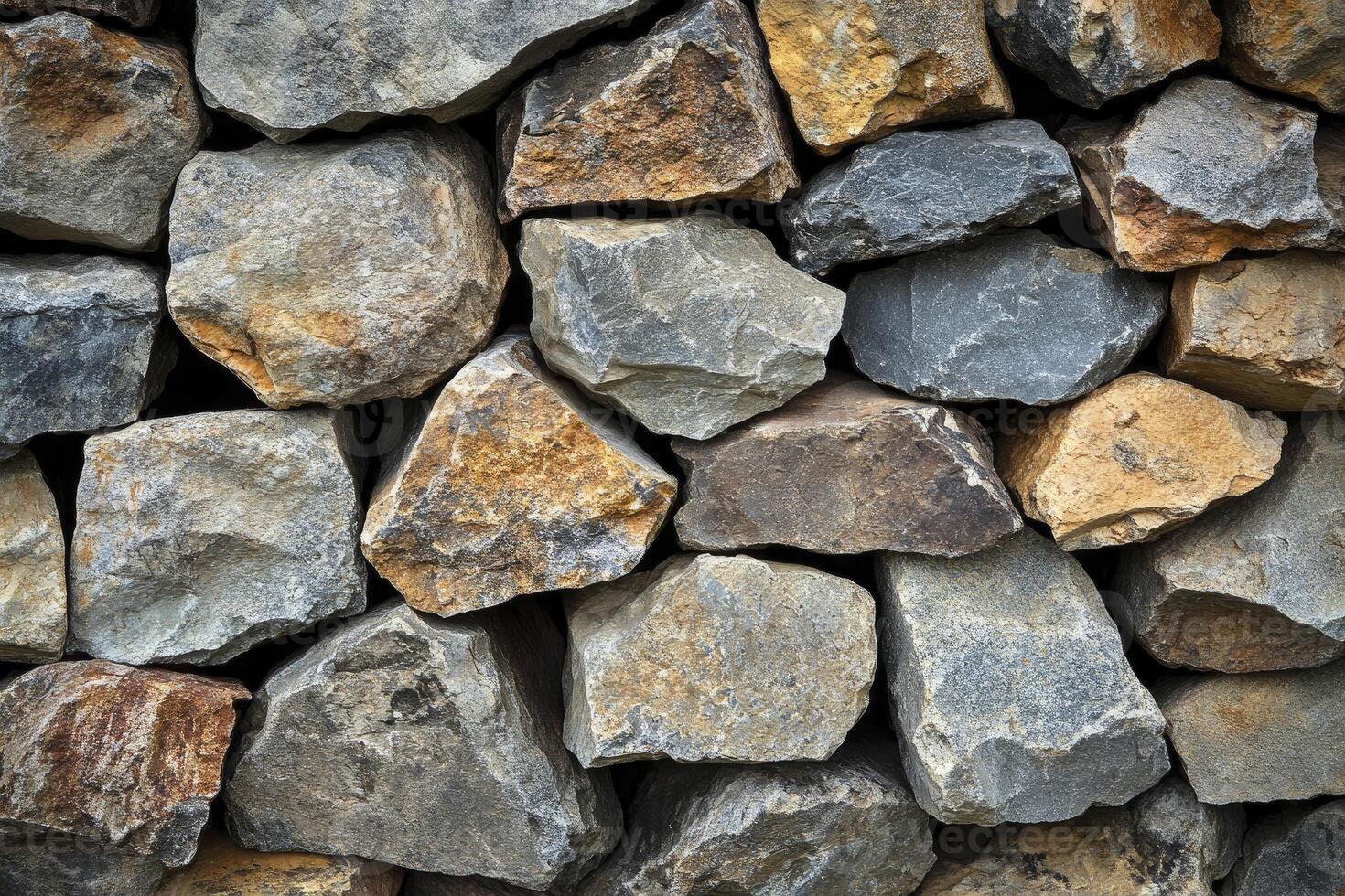 Stacked Stone Wall Texture with Natural Colors and Rough Surface Detail photo