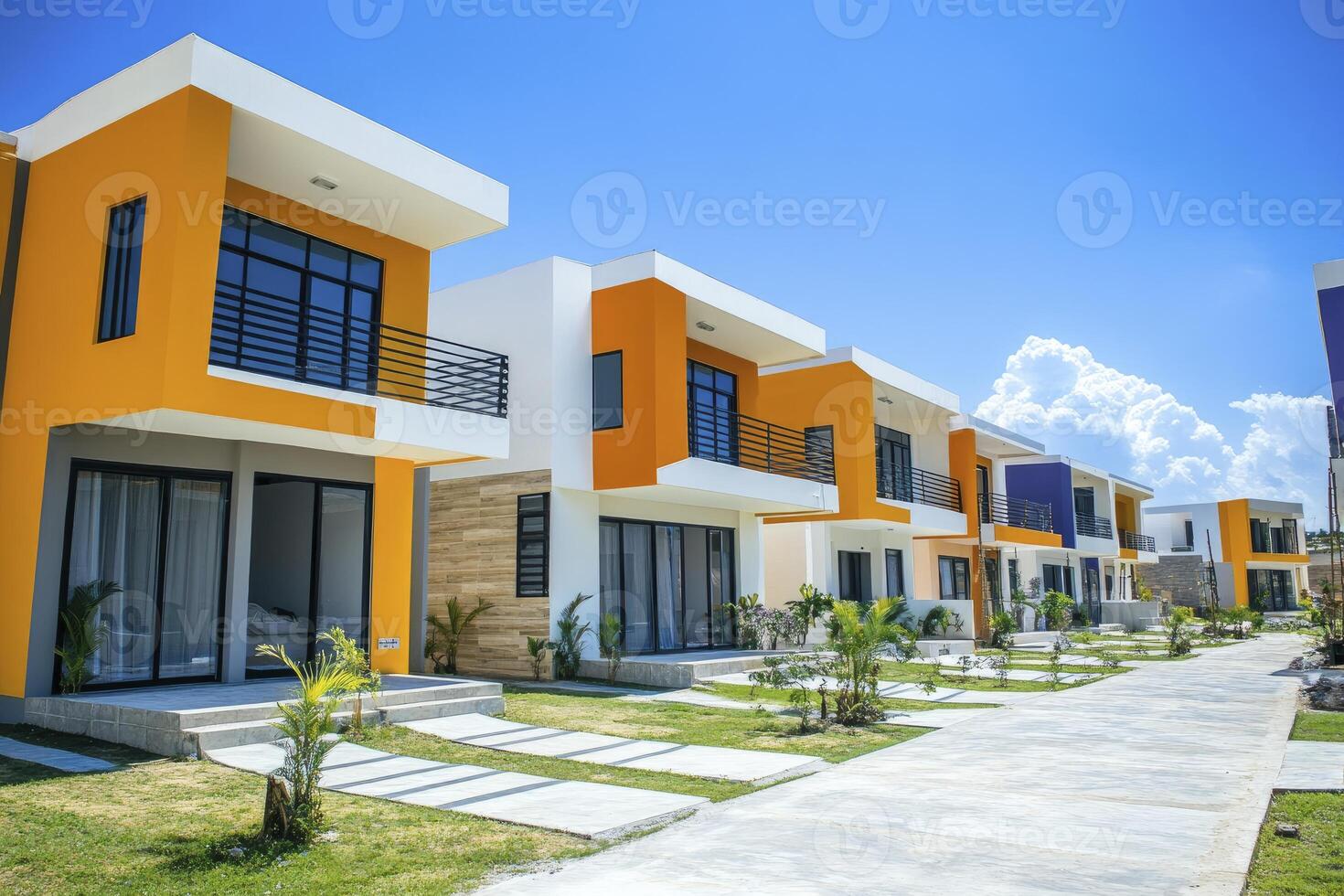 Row of Modern Townhouses with Colorful Facades and Blue Sky photo