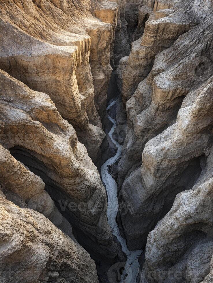 Aerial View of River Winding Through a Deep Canyon Landscape photo