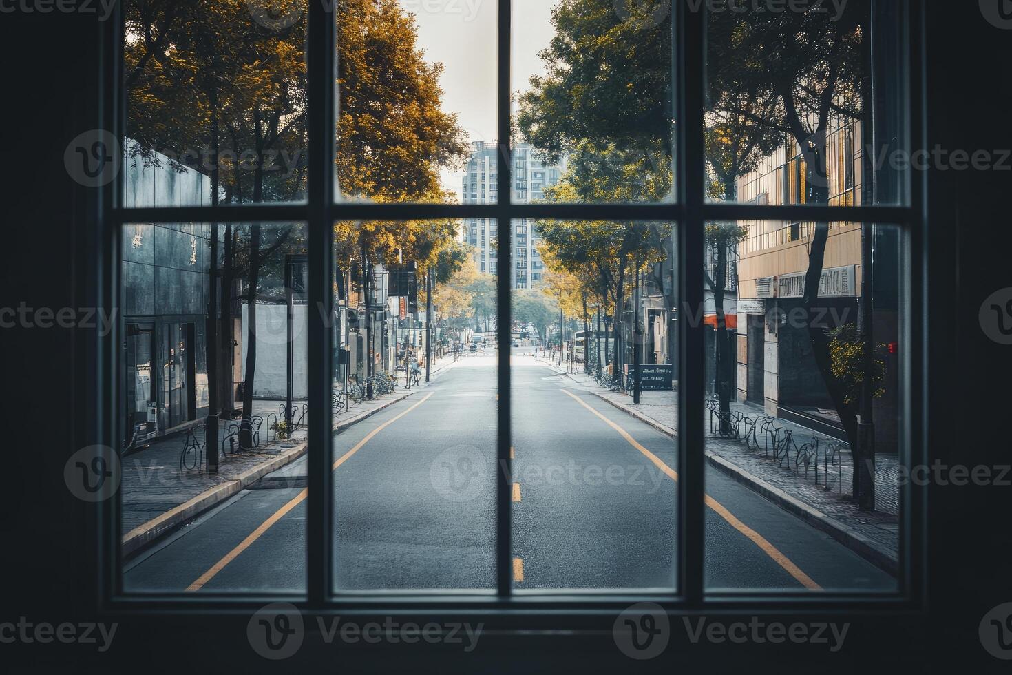 City Street View Through Window on Autumn Day with Empty Road photo