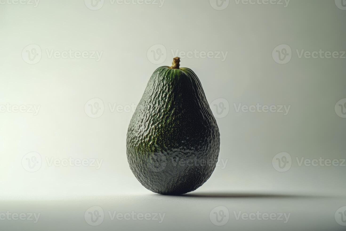 Single Green Avocado Standing Isolated on Gradient Background in Studio Light photo
