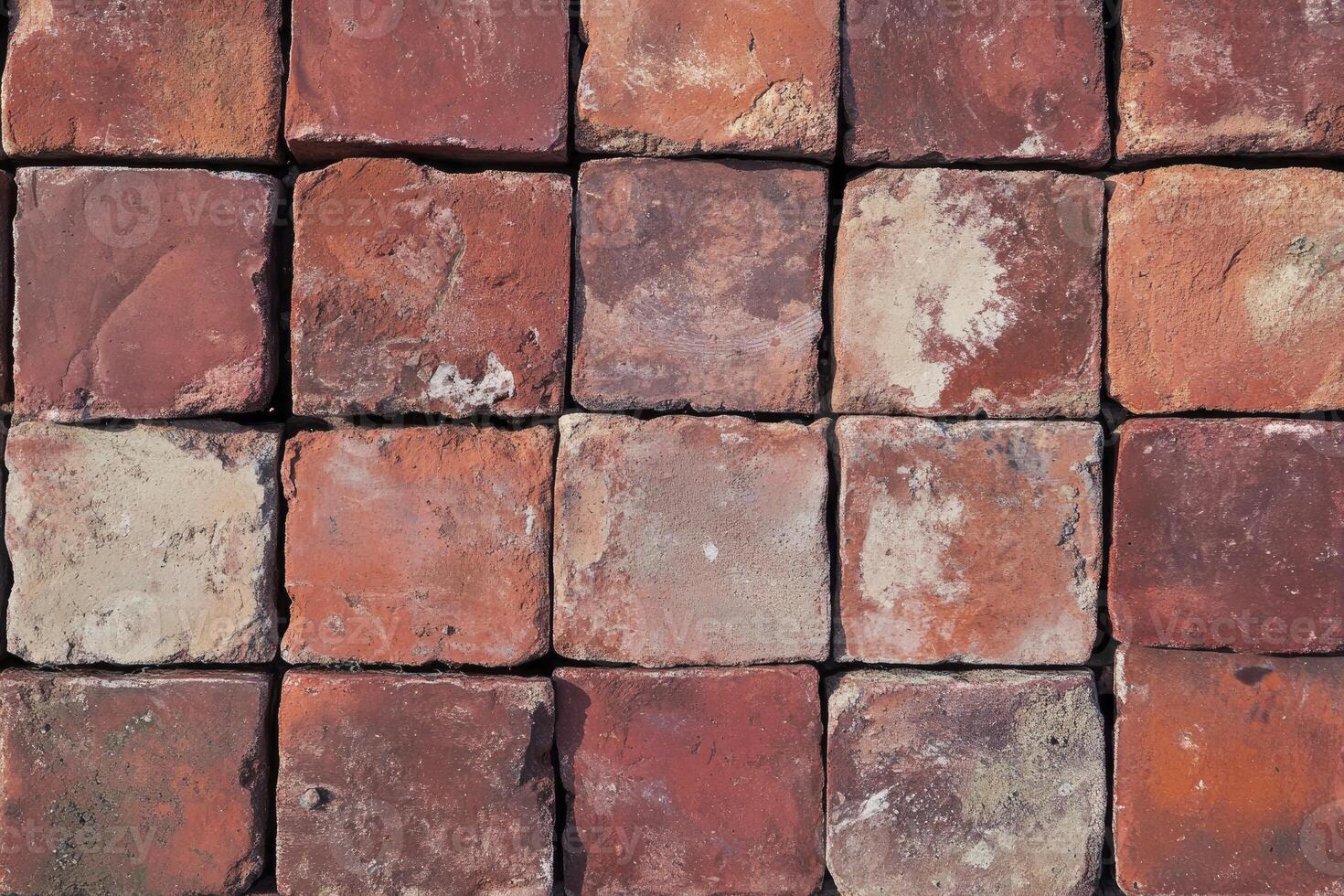 Arrangement of Square Red Bricks Creating Textured Wall Background photo