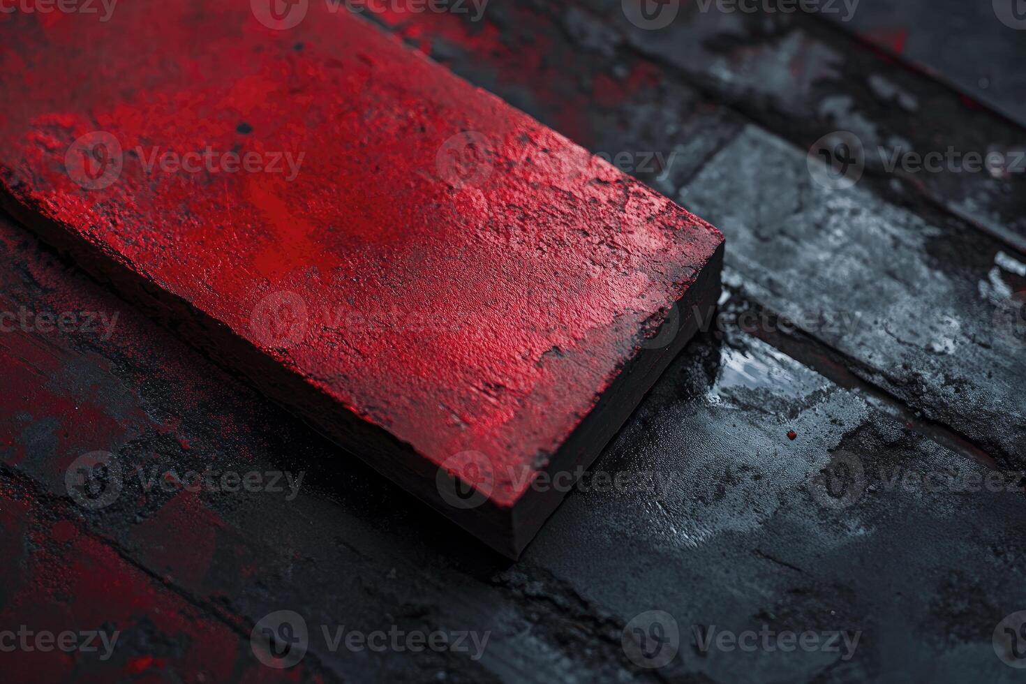 Textured Red Block on Dark Wood Background - Artistic Close Up photo