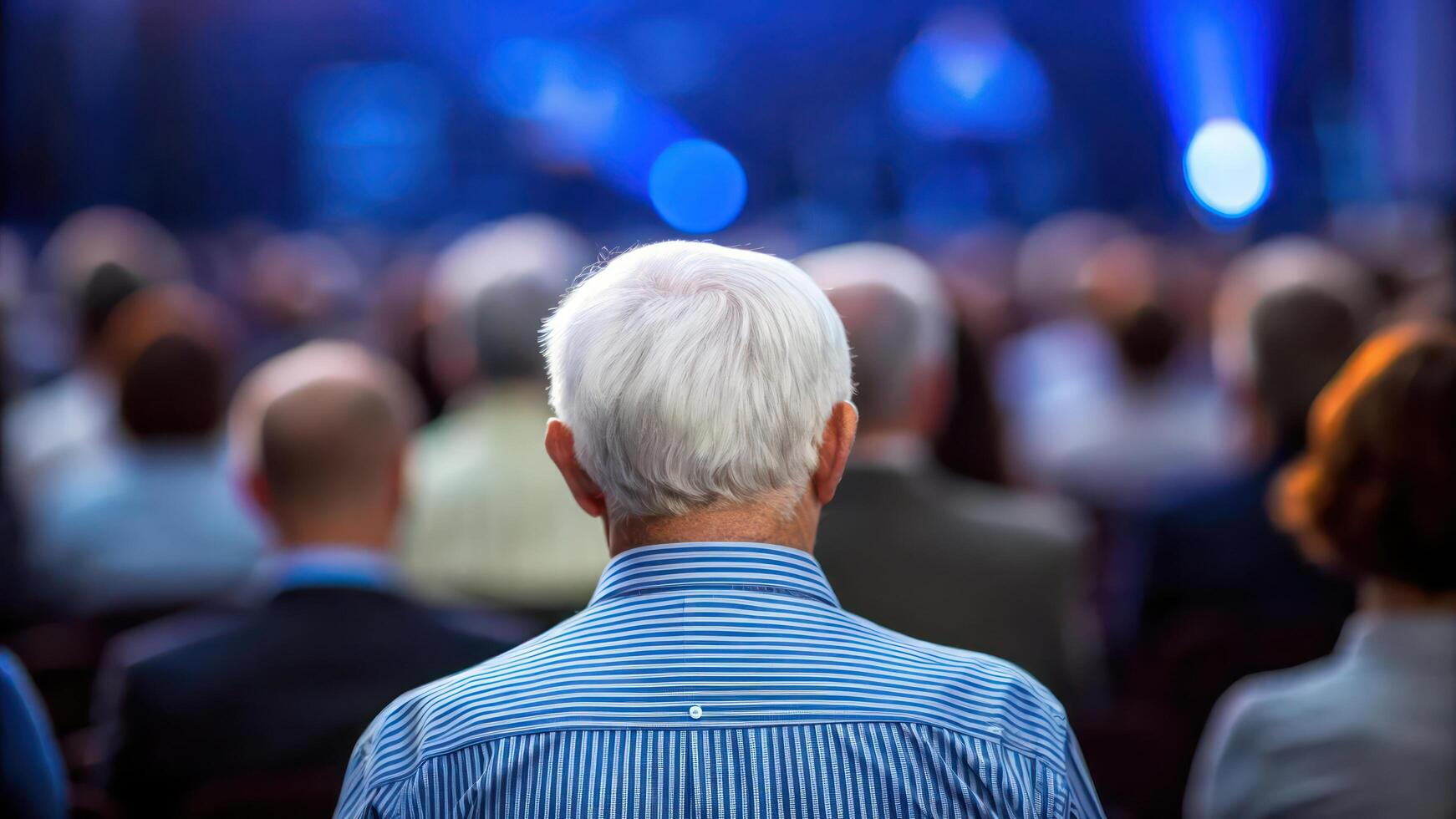 Back view of elderly man at a conference photo