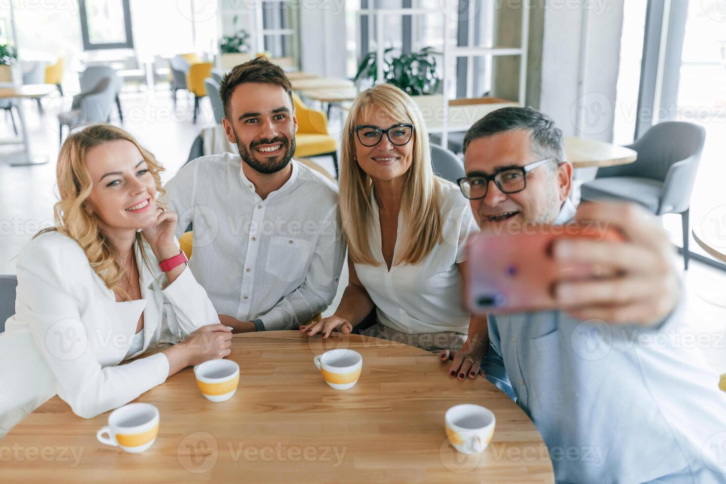 Making selfie... Group ,of professional business people is in the office. photo