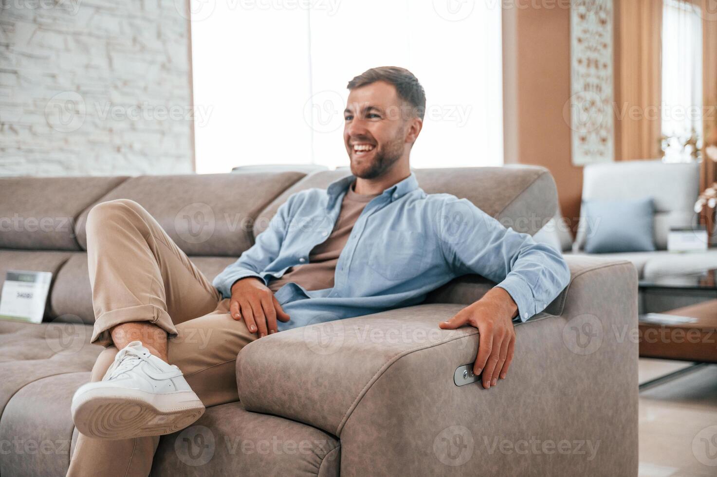 Sitting and enjoying. .Customer visiting the sofa and bed store. Looking for update photo