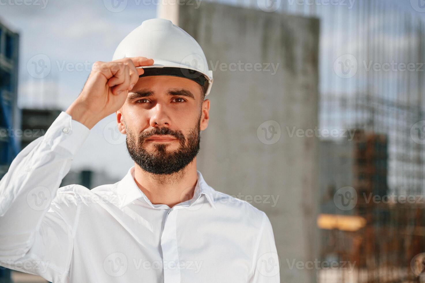 Portrait ,of, man that is in uniform on the construction site photo