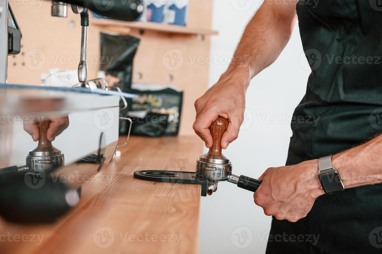 Preparing, coffee by, special tool. Barista in the cafe. Close up view photo