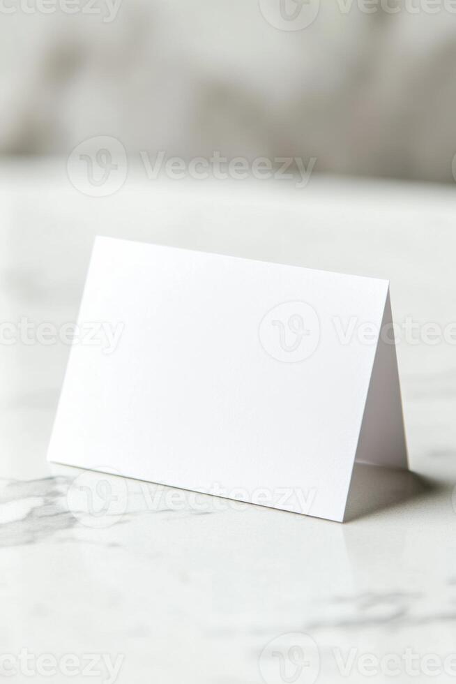 A blank white card on a marble table photo