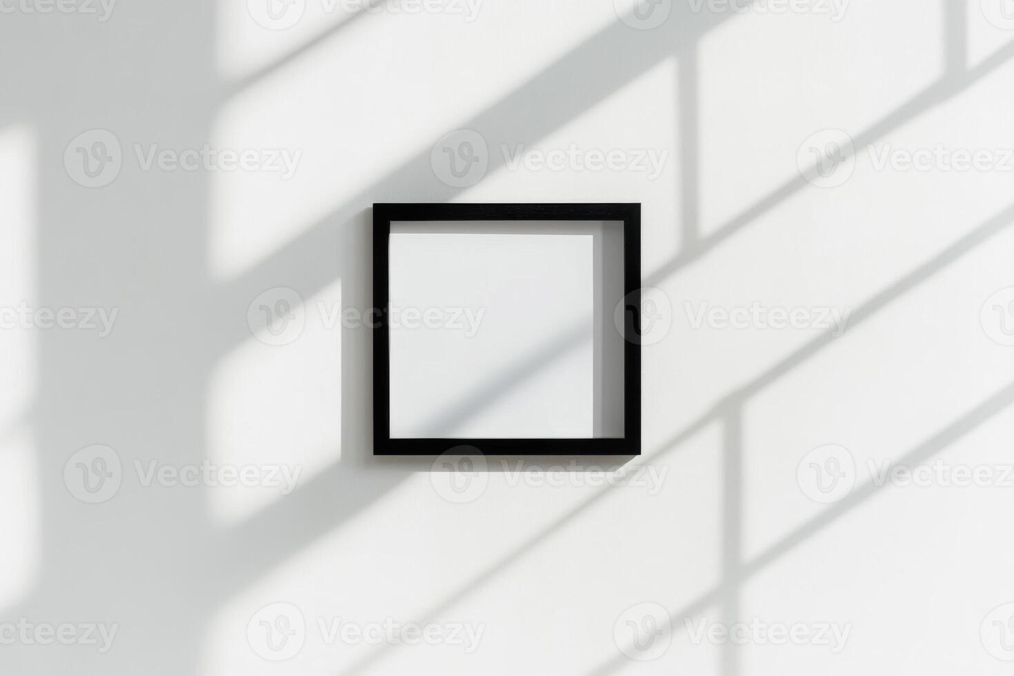 A black square frame on a white wall photo