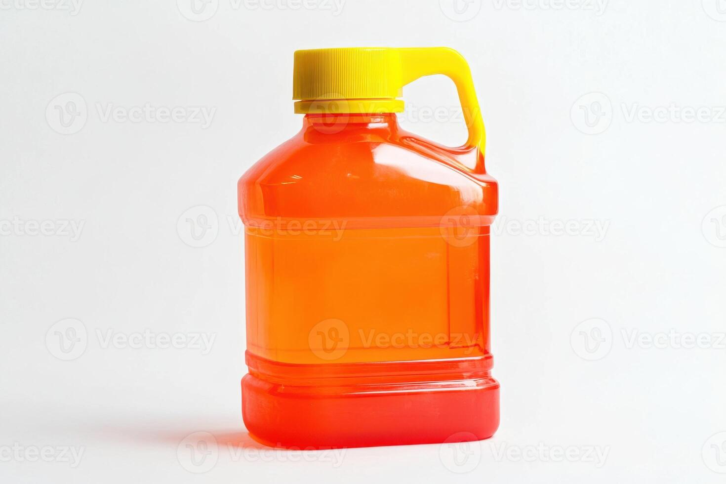 Orange liquid bottle with yellow lid on white background photo
