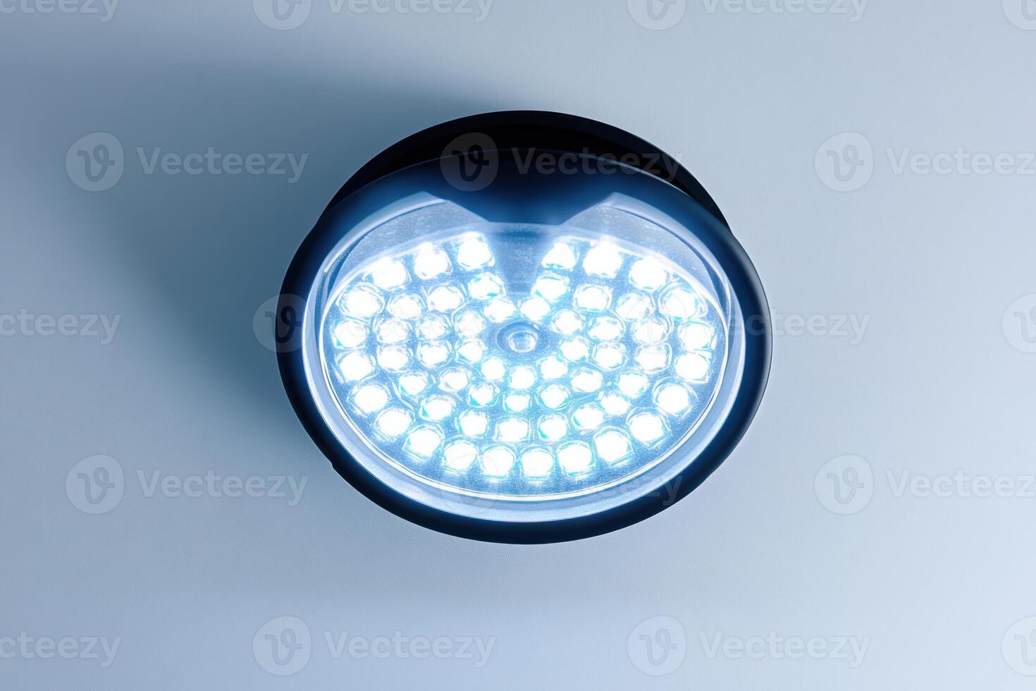 A close up of a light on a wall photo