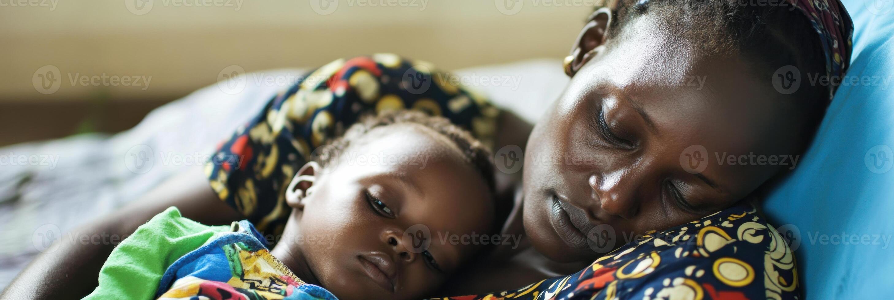 A woman holding a baby in her arms photo