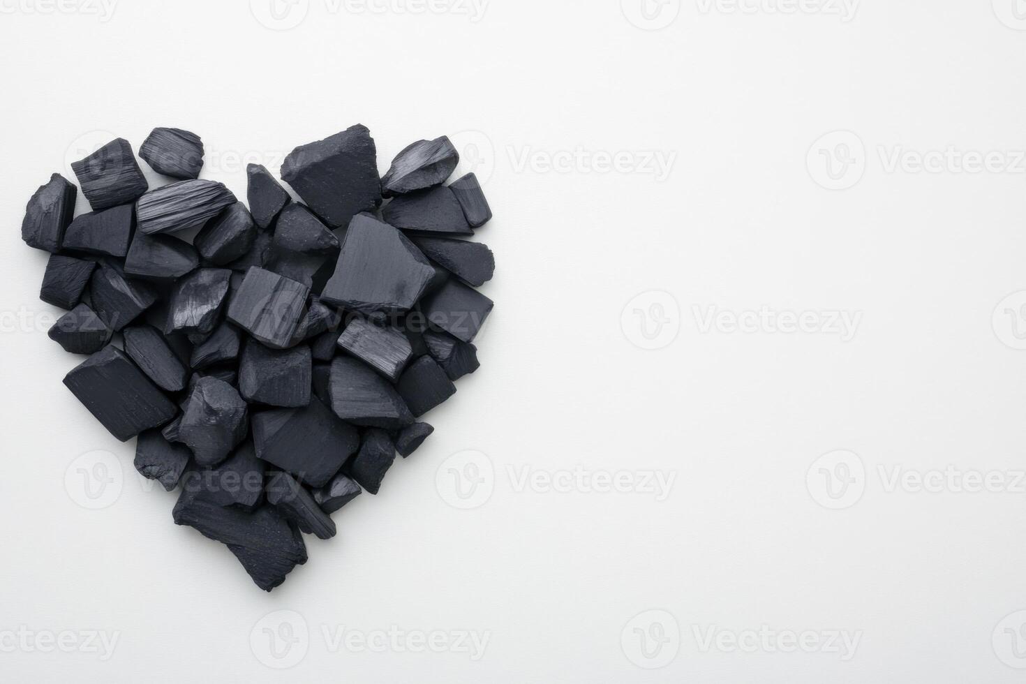 Creative heart shape made from artistic charcoal pieces arranged for minimalistic charm photo