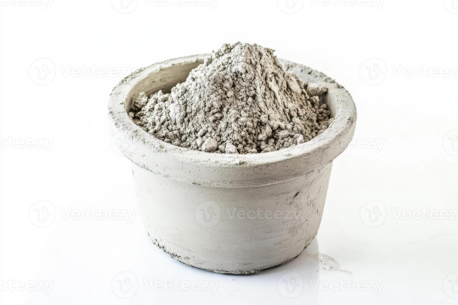 Cement mortar in a clay bowl on a clean white background for construction and repair applications photo