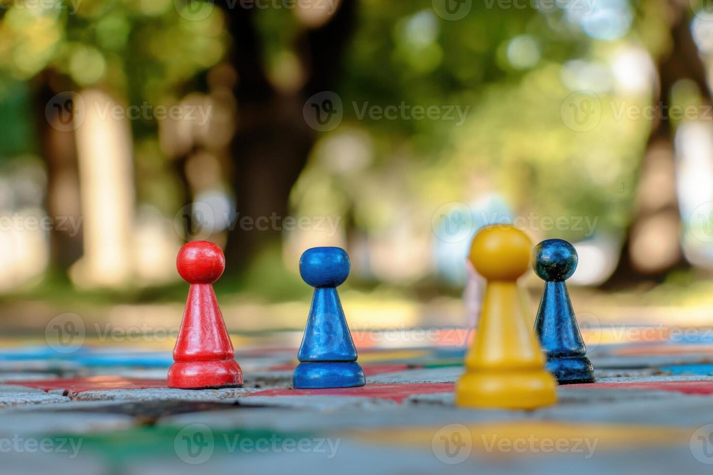 Outdoor childrens games featuring colorful game pieces in a serene park setting photo