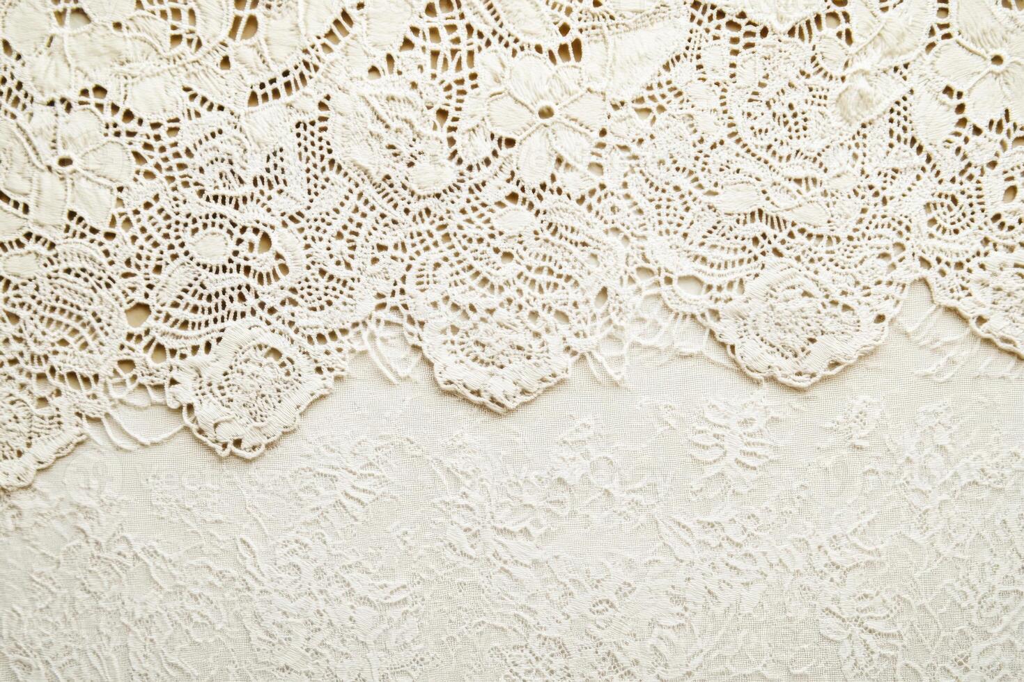Intricate lace patterns on a soft background create a refined setting for creative designs photo