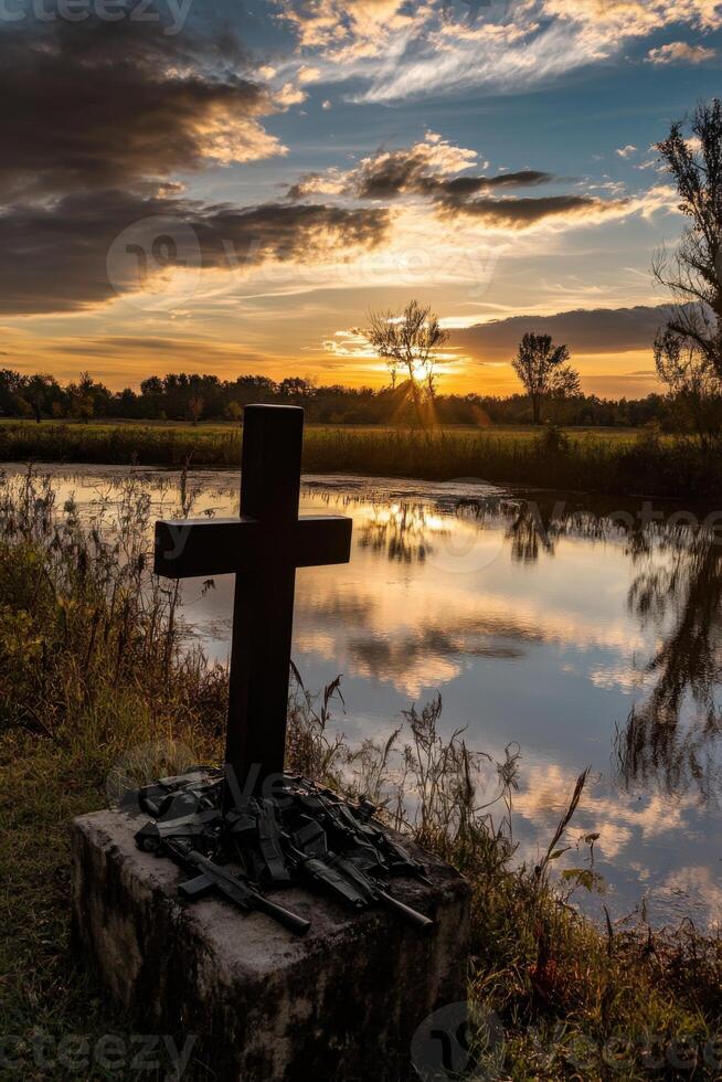 Serene tribute to veterans with a cross at sunset reflecting peace and remembrance in nature photo