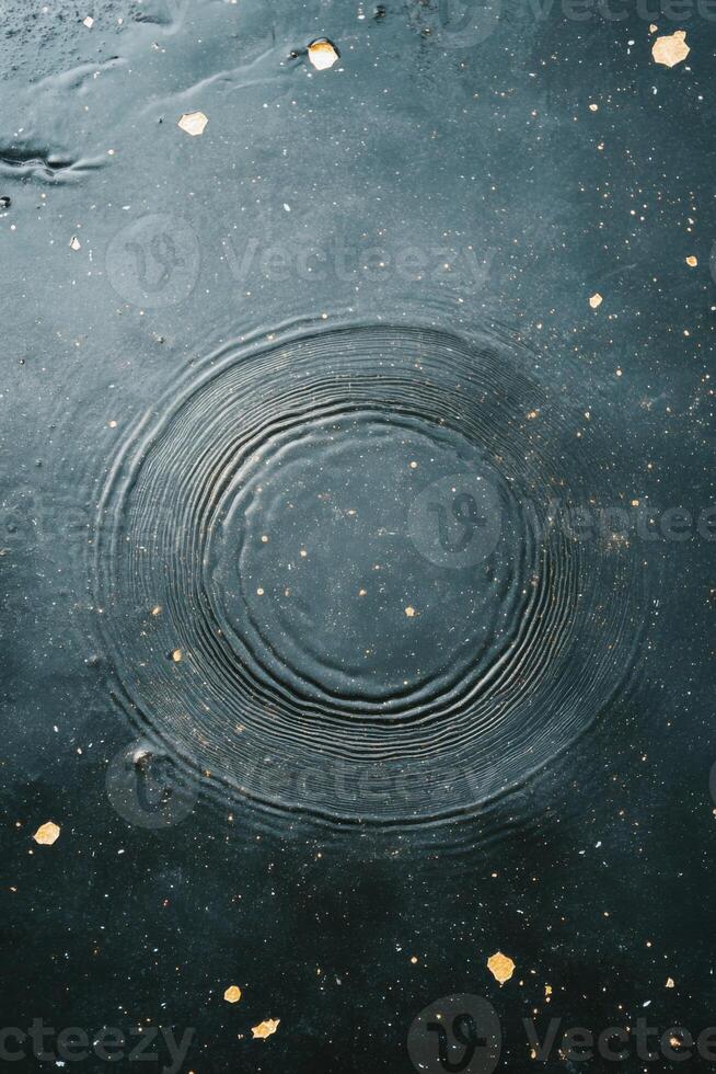 Celestial ripples create astrological imprints on a dark canvas resembling star maps photo