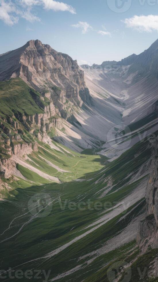 A mountain valley with green grass and mountains photo