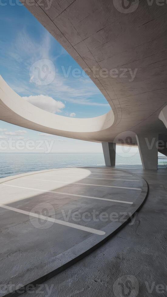 A large concrete structure with a circular roof and a parking lot photo