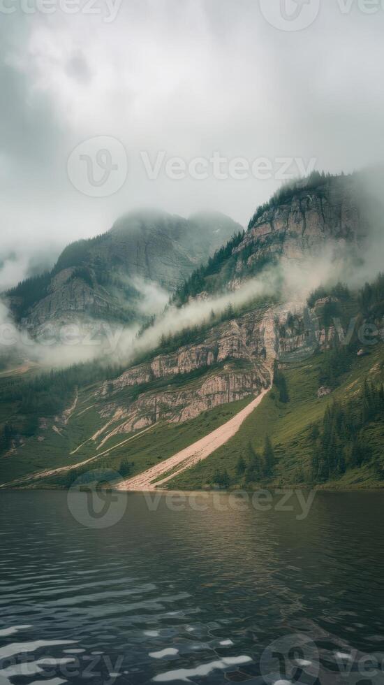 A lake surrounded by mountains and trees photo
