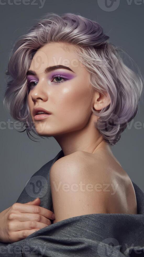A beautiful young woman with purple hair and makeup photo