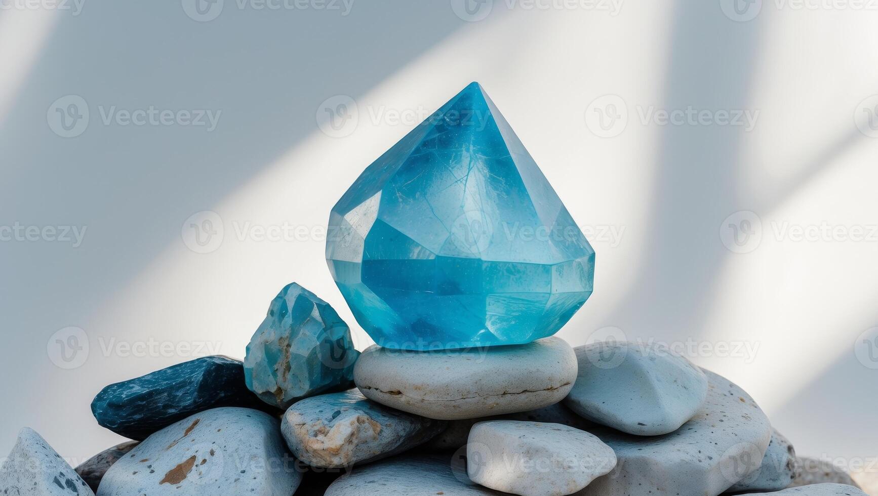 a close up of a large blue crystal on a pile of rocks. photo