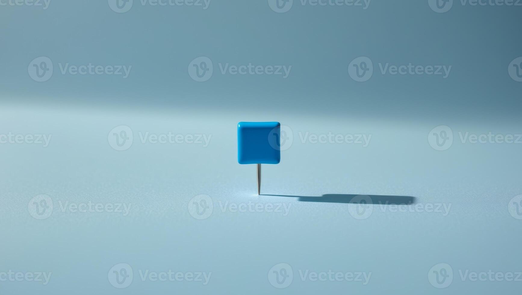 Blue Push Pin on a Light Blue Background photo