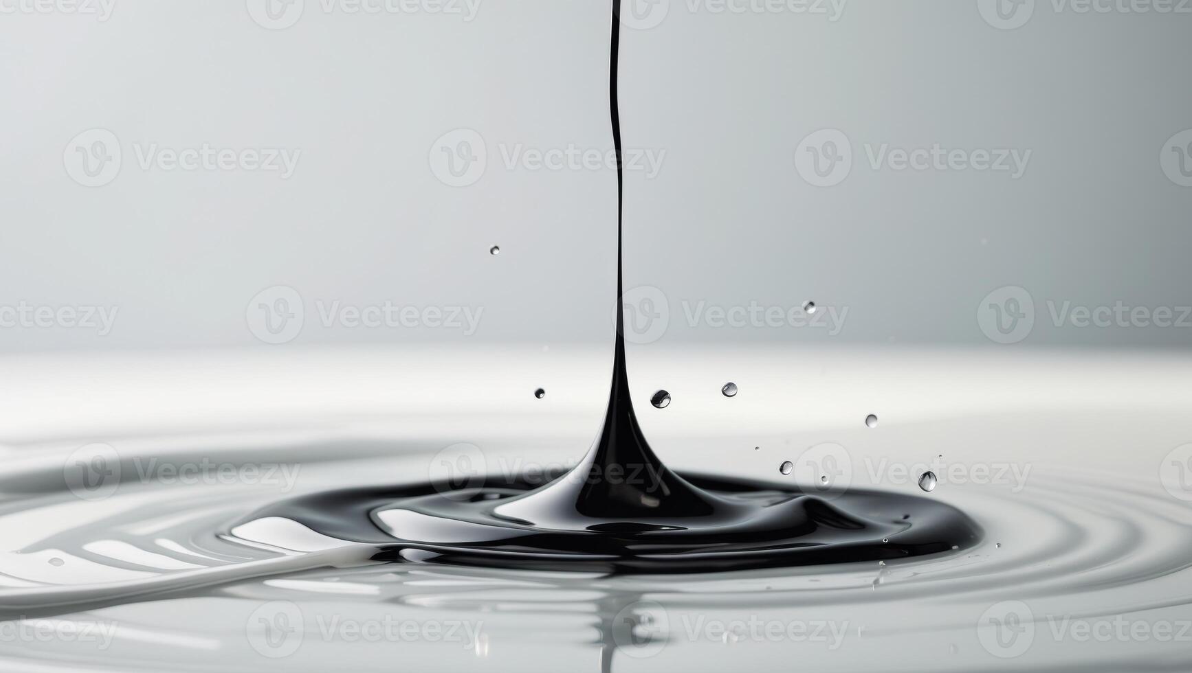 Abstract Black Liquid Drop Impacting Surface. photo