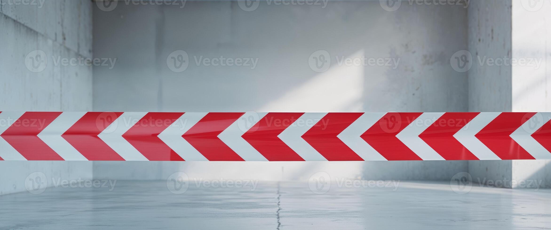 Red and white barrier tape signifying no entry in unsafe areas with clear copy space for warnings. photo