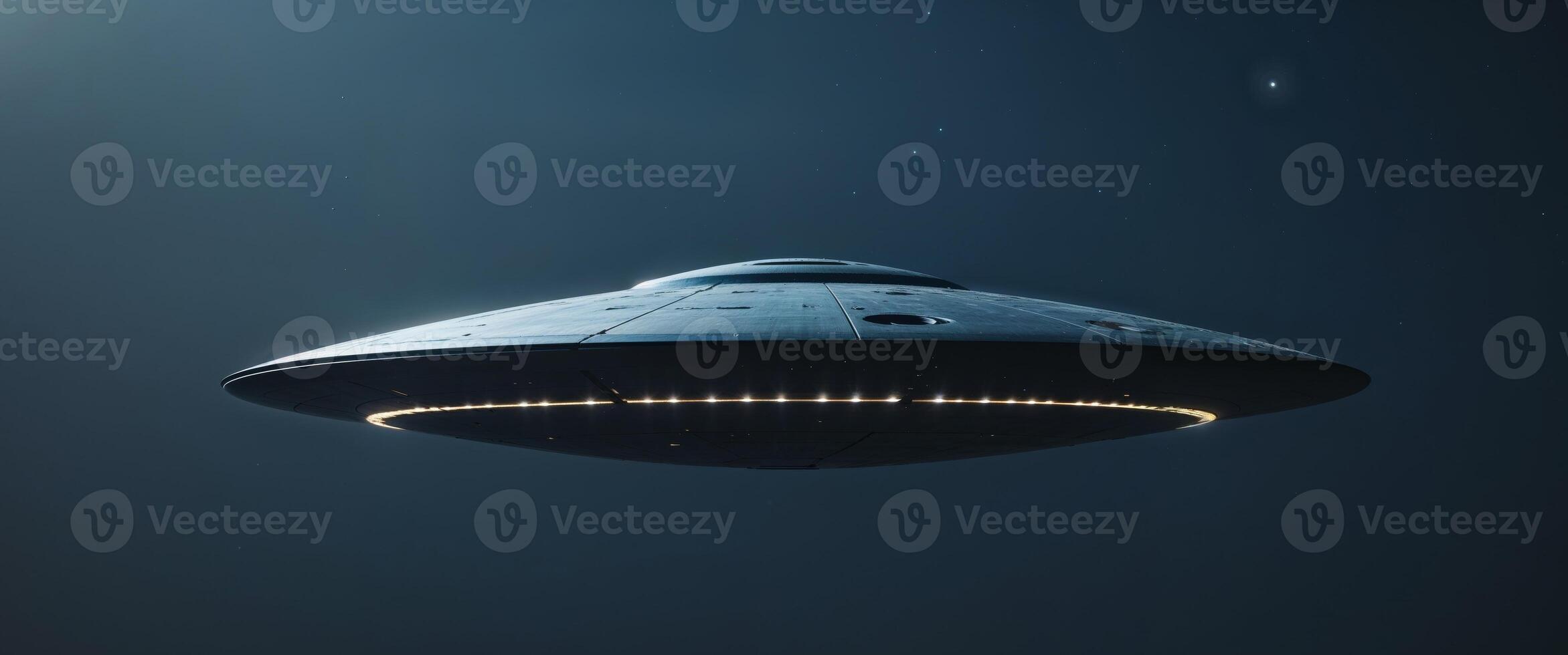 A Dark Metallic Flying Saucer With Glowing Lights In Space photo