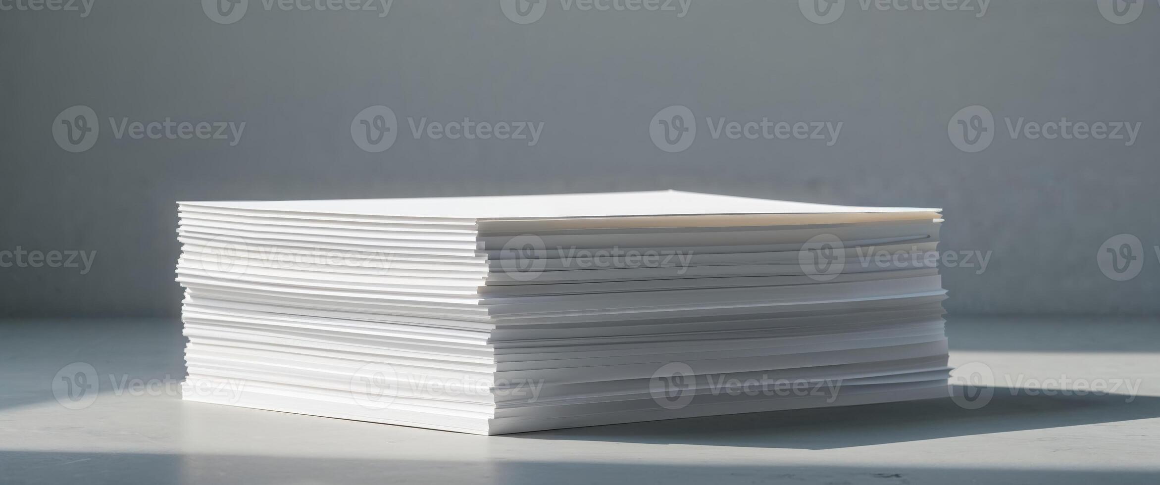 Stack of white paper on a table photo
