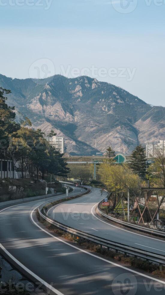 A highway with mountains in the background photo