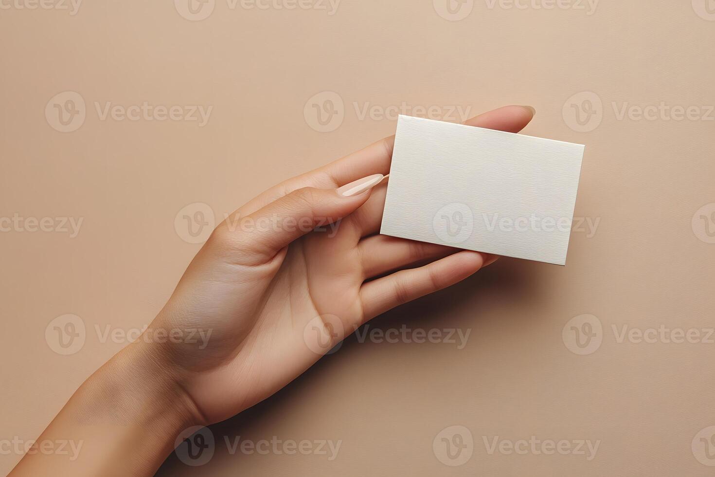 Minimalist Business Card Presentation with Elegant Hand on Neutral Background for Branding Concepts photo