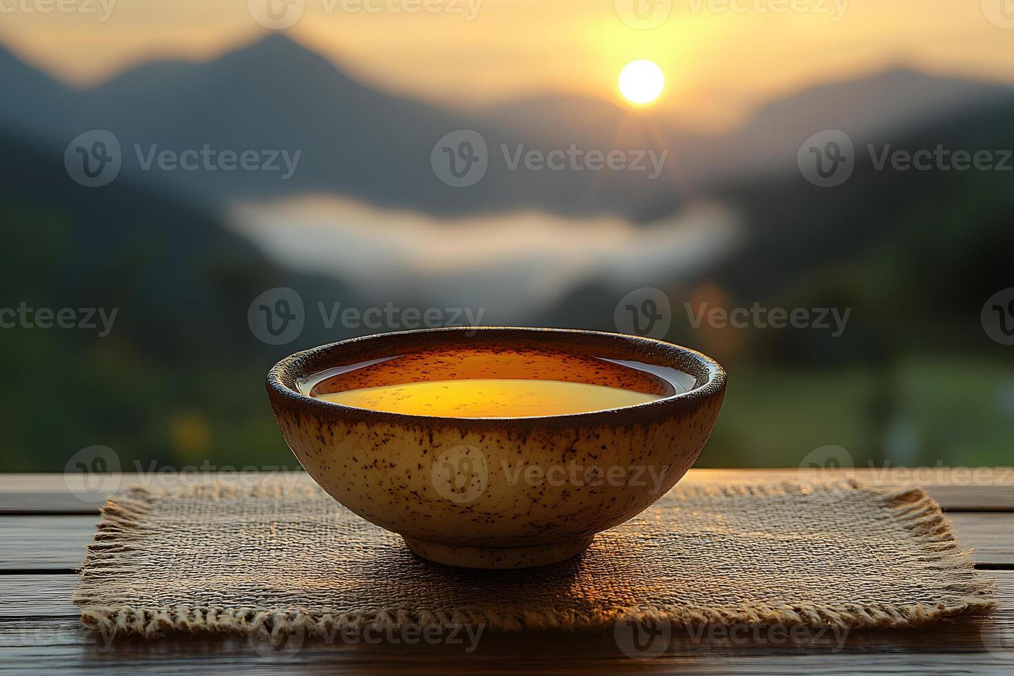 Tranquil Sunrise with Warm Tea in Rustic Bowl for Relaxation and Calm photo