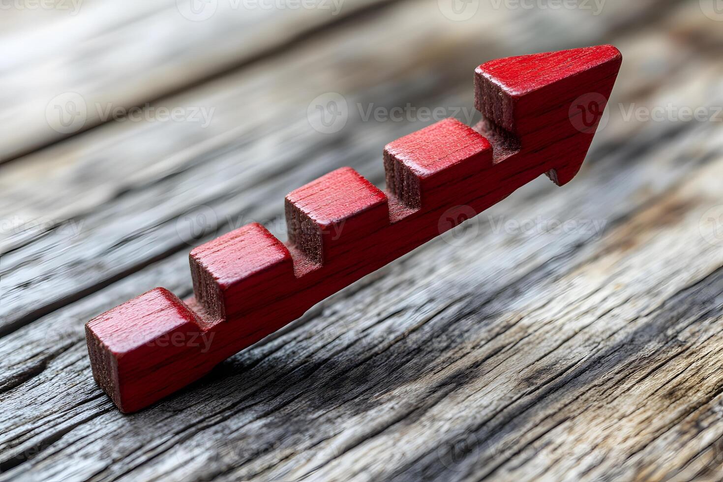 Red Wooden Arrow Staircase on Rustic Wood Background - Growth and Success Concept photo