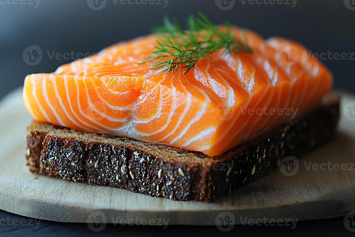 Fresh Salmon Sashimi on Rye Bread with Dill Garnish for Gourmet Culinary Presentation photo