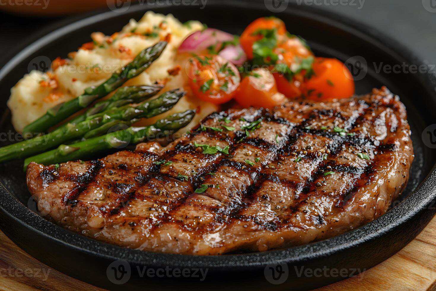 Grilled Ribeye Steak with Asparagus, Mashed Potatoes, and Cherry Tomatoes - Gourmet Cuisine photo