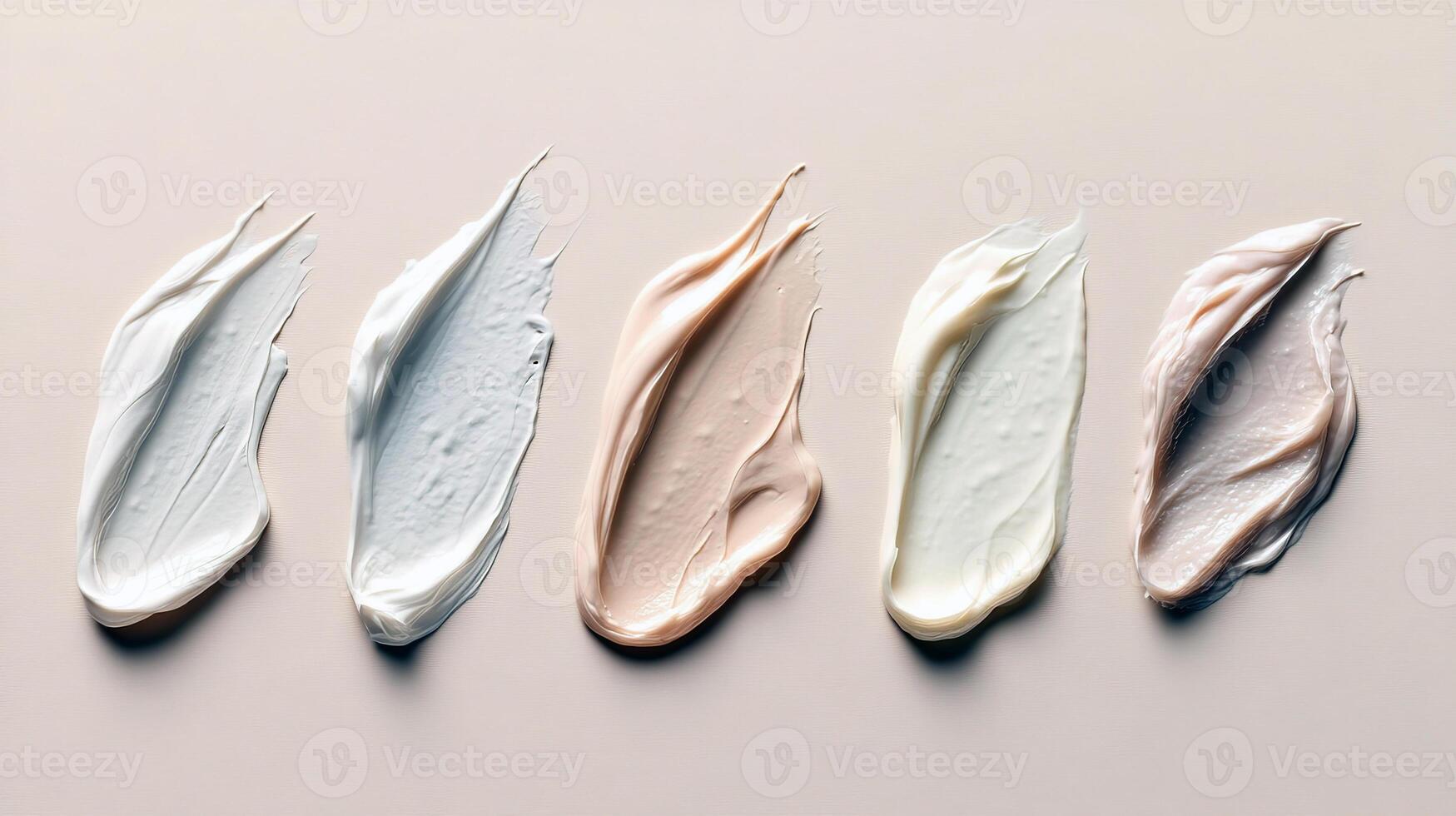 Assorted cosmetic cream smears in neutral shades on beige background photo