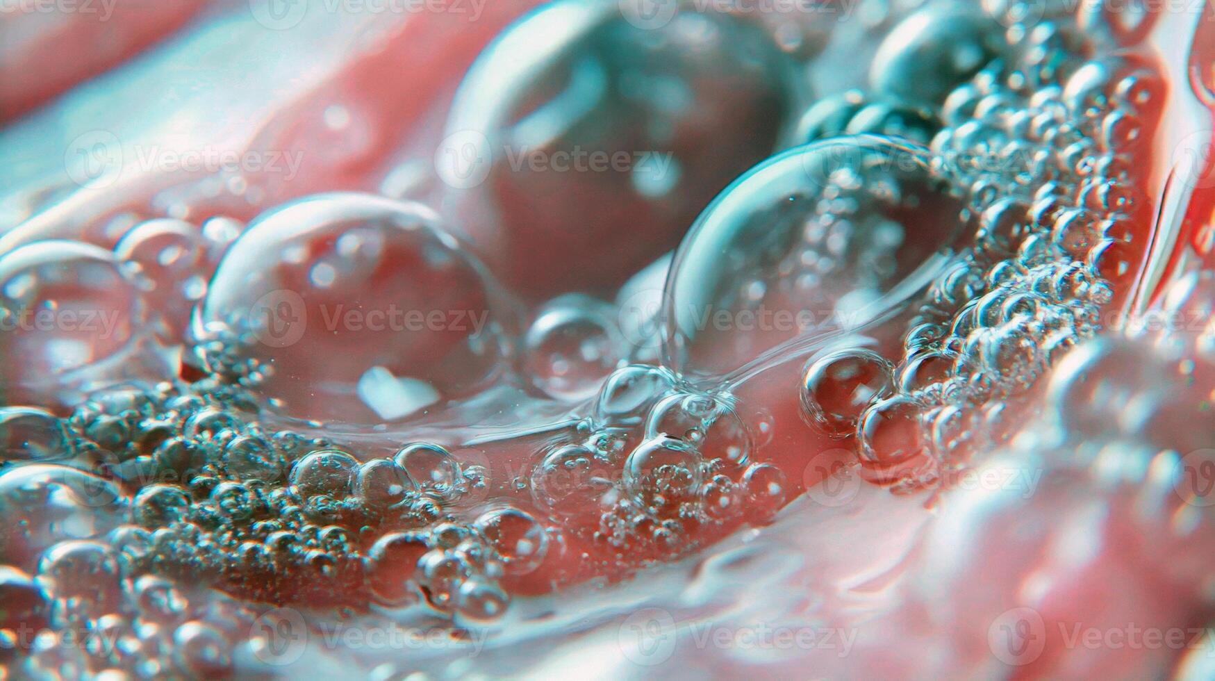Close-up of pink transparent bubbles in liquid texture background photo