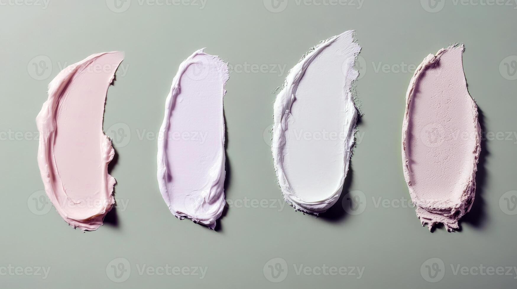 Green background with four cream smears in different shades and textures photo
