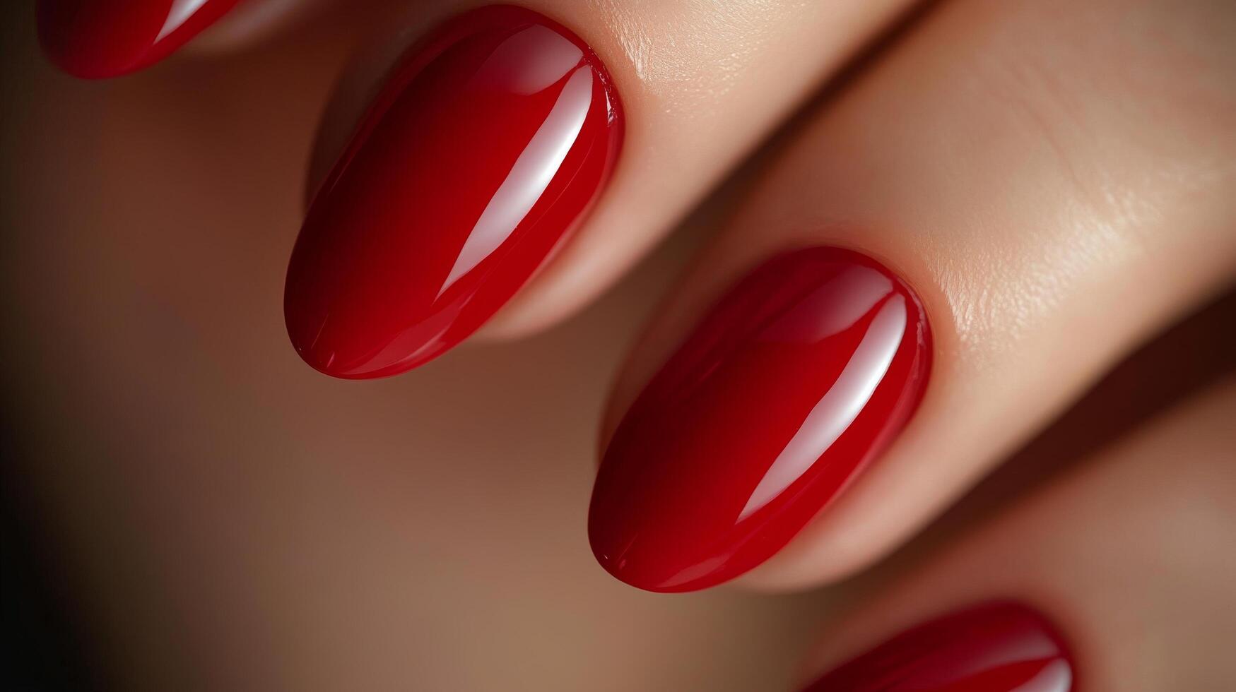 Close-up of red manicured nails with glossy finish photo