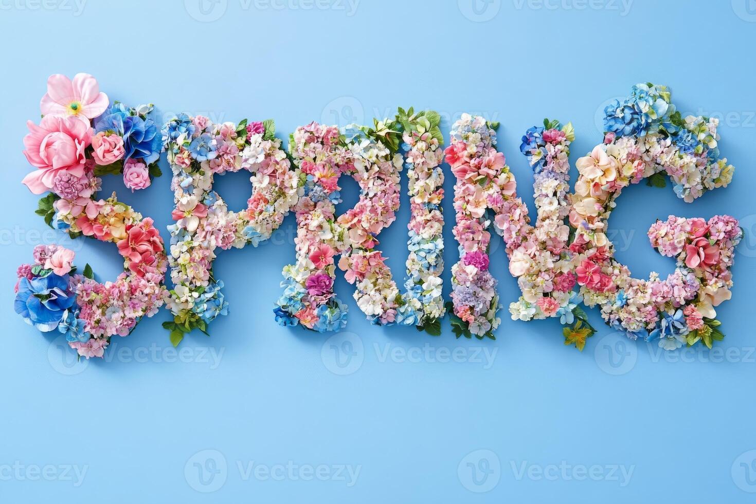Floral spring lettering on blue background with colorful flowers photo