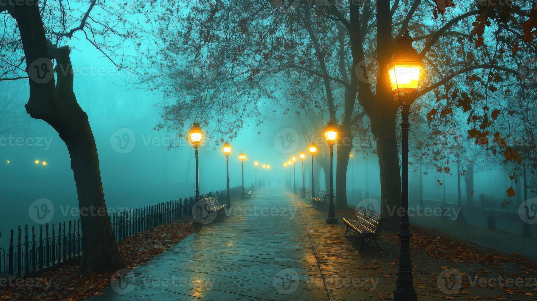 Serene foggy park path lined with glowing lanterns and autumn trees photo