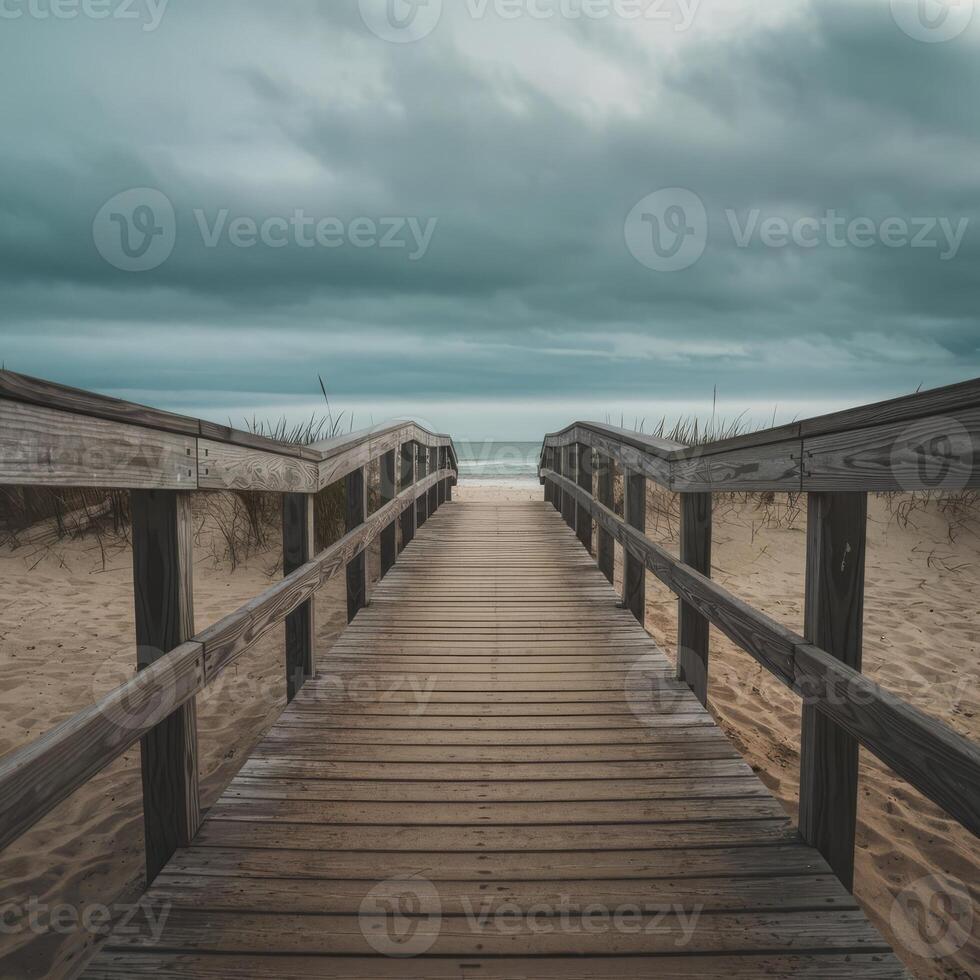 A wooden walkway leading to the ocean photo