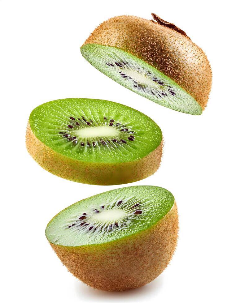 A ripe kiwifruit sliced and floats in the air isolated on white background. photo