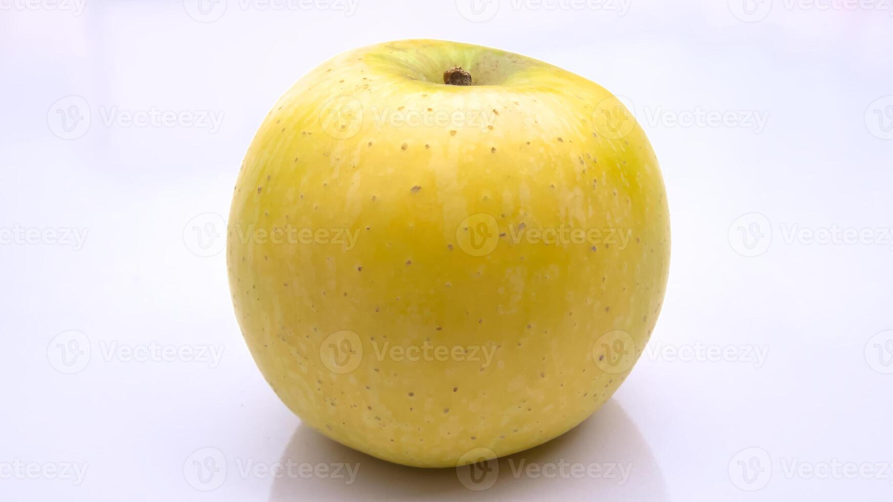 Golden Delicious Apple, Close-Up Isolated on White Background photo